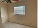 Small bedroom with neutral walls and carpet flooring at 5163 Jasmine Cir, St Petersburg, FL 33714