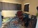 Multi-purpose room with a bicycle, chair, and sleeping area at 5163 Jasmine Cir, St Petersburg, FL 33714