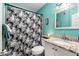 Clean bathroom with granite vanity and teal walls at 5251 39Th N Ave, St Petersburg, FL 33709