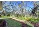 Landscaped backyard with lush greenery at 5823 Audubon Manor Blvd, Lithia, FL 33547