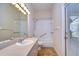 Accessible bathroom with walk-in shower and tub at 5823 Audubon Manor Blvd, Lithia, FL 33547