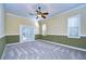 Bright bedroom with carpet flooring and French doors at 5823 Audubon Manor Blvd, Lithia, FL 33547