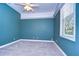 Serene bedroom with teal walls and carpeted floor at 5823 Audubon Manor Blvd, Lithia, FL 33547