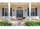 Elegant front door entrance with a brick walkway and lush landscaping at 5823 Audubon Manor Blvd, Lithia, FL 33547