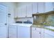 Laundry room with granite countertop and washer/dryer at 5823 Audubon Manor Blvd, Lithia, FL 33547