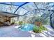 Screened pool with surrounding patio and lounge area at 5823 Audubon Manor Blvd, Lithia, FL 33547