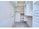 Large walk-in closet with ample shelving and drawers at 5823 Audubon Manor Blvd, Lithia, FL 33547