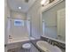 Clean bathroom with a bathtub, toilet and granite countertop at 6321 Voyagers Pl, Apollo Beach, FL 33572