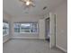 Bright bedroom featuring neutral tones, multiple windows offering natural light, and a ceiling fan at 6321 Voyagers Pl, Apollo Beach, FL 33572