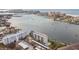 Aerial view of waterfront condo building with pool and parking at 644 Island Way # 206, Clearwater, FL 33767