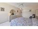 Comfortable bedroom with ceiling fan and ample closet space at 644 Island Way # 206, Clearwater, FL 33767