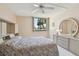 Bright bedroom with a large window and ceiling fan at 644 Island Way # 206, Clearwater, FL 33767