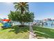 Kayaks near a dock and palm trees at 644 Island Way # 206, Clearwater, FL 33767