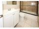 Updated bathroom with a tub shower combo at 6911 El Camino Paloma St, Port Richey, FL 34668