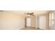 Bright bedroom with ceiling fan and large closet at 6911 El Camino Paloma St, Port Richey, FL 34668