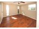 Spacious bedroom with wood-look flooring and large windows at 6911 El Camino Paloma St, Port Richey, FL 34668