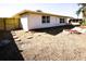 Side yard with landscaping and a wooden fence at 6911 El Camino Paloma St, Port Richey, FL 34668