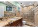 Updated bathroom with granite countertop and walk-in shower at 7007 Lambright Ct, Tampa, FL 33634