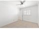 Bright bedroom with ceiling fan and window shutters at 7007 Lambright Ct, Tampa, FL 33634