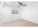 Bright bedroom with tile floors, double closets, and window shutters at 7007 Lambright Ct, Tampa, FL 33634