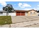 House exterior showcasing a two-car garage and front yard at 7007 Lambright Ct, Tampa, FL 33634