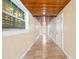 Bright hallway with wood ceilings and tile floors at 7007 Lambright Ct, Tampa, FL 33634