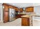 Modern kitchen with wood cabinets and granite countertops at 7007 Lambright Ct, Tampa, FL 33634