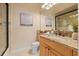 Bathroom featuring a granite vanity top, marble floors and a glass enclosed shower at 7401 Watersilk Dr, Pinellas Park, FL 33782