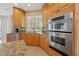 Kitchen area showcasing stainless steel appliances and granite countertops at 7401 Watersilk Dr, Pinellas Park, FL 33782