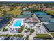 The community pool, tennis courts and parking viewed from above at 7566 Links Ct, Sarasota, FL 34243