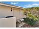 Exterior view of the side of the home and a small garden at 7566 Links Ct, Sarasota, FL 34243