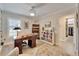 Well-lit office featuring floor to ceiling bookcases and a neutral palette at 7566 Links Ct, Sarasota, FL 34243