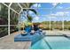 Beautiful raised spa next to pool inside screened lanai, offering an ideal spot to unwind at 7566 Links Ct, Sarasota, FL 34243