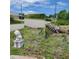 Landscaped yard with a lion statue and palm tree at 8490 Leopold Ave, North Port, FL 34287