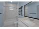 Bathroom featuring bathtub, vanity and a tiled shower at 8716 N Brooks St, Tampa, FL 33604