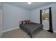 Bedroom with large window and closet at 8716 N Brooks St, Tampa, FL 33604