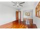 Bedroom with hardwood floors and mirrored closet at 906 W Henry Ave, Tampa, FL 33604