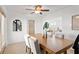 Dining room with modern lighting, white seating, and stylish decor at 906 W Henry Ave, Tampa, FL 33604