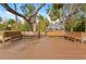 Waterfront dock featuring wooden benches, ideal for relaxing and enjoying scenic views of the surrounding nature at 906 W Henry Ave, Tampa, FL 33604