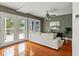 Inviting living room with French doors that lead to a deck and outdoor living area at 906 W Henry Ave, Tampa, FL 33604