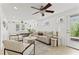 Cozy living room with bright white interior, modern furniture, and neutral decor at 906 W Henry Ave, Tampa, FL 33604