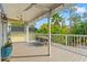 Covered patio with outdoor seating and lush tropical views at 906 W Henry Ave, Tampa, FL 33604