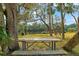 Outdoor picnic area with a wooden picnic table overlooking the water at 906 W Henry Ave, Tampa, FL 33604