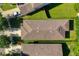 Aerial view of house showing roofline and landscaping at 929 Windton Oak Dr, Ruskin, FL 33570