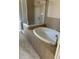 Relaxing bathroom with garden tub and separate shower at 929 Windton Oak Dr, Ruskin, FL 33570