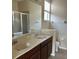 Bathroom boasts double sinks and a shower/tub combo at 929 Windton Oak Dr, Ruskin, FL 33570