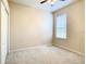 Bright bedroom featuring a window with blinds and ceiling fan at 929 Windton Oak Dr, Ruskin, FL 33570