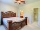 Main bedroom with large bed and walk-in closet at 929 Windton Oak Dr, Ruskin, FL 33570