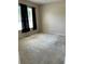 Simple bedroom with neutral wall and carpet at 929 Windton Oak Dr, Ruskin, FL 33570