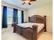 Large bedroom with plush carpeting and ensuite bathroom at 929 Windton Oak Dr, Ruskin, FL 33570